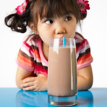 Girl Enjoying Chocolate Milk